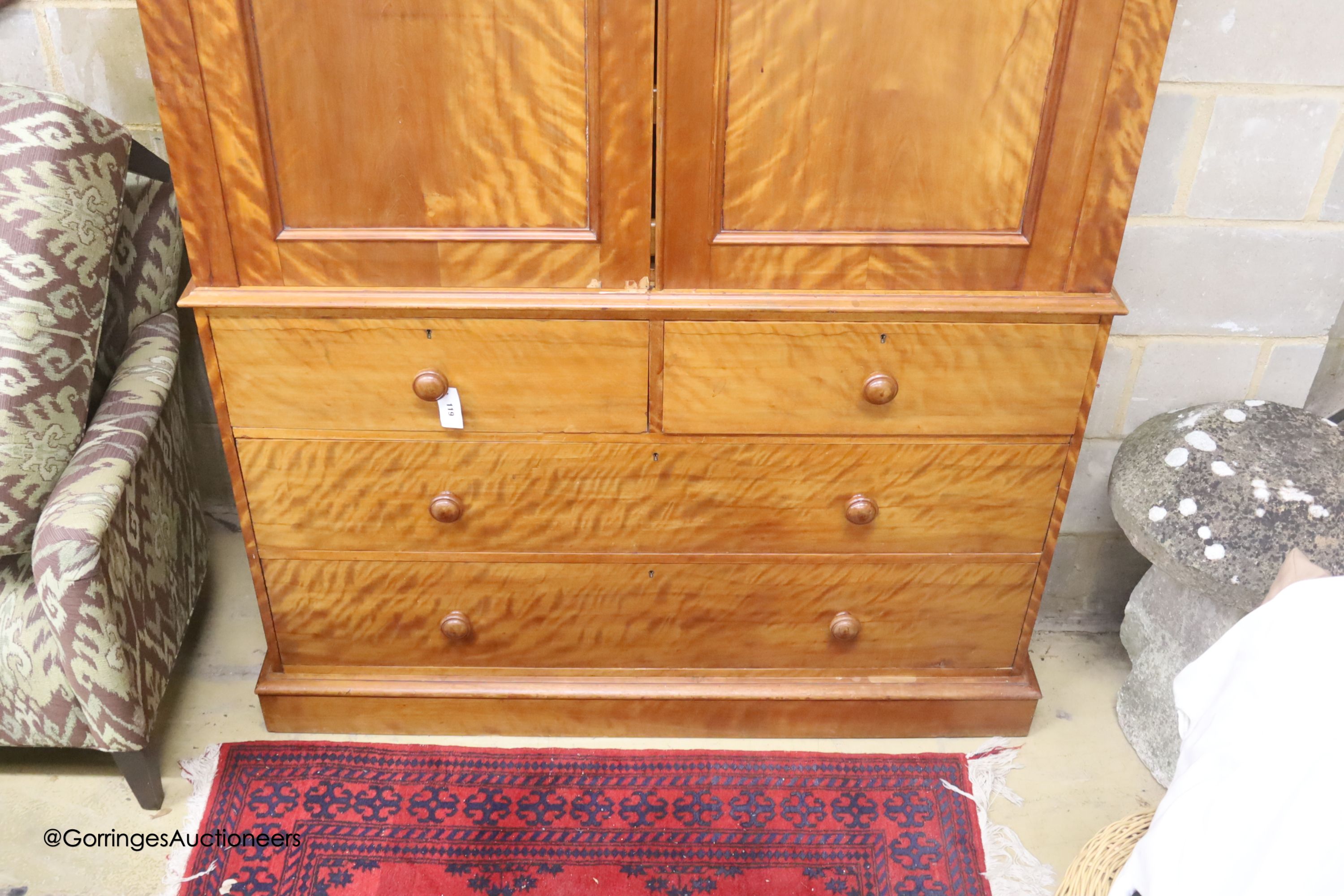 A Victorian satin birch linen press, width 137cm depth 57cm height 214cm